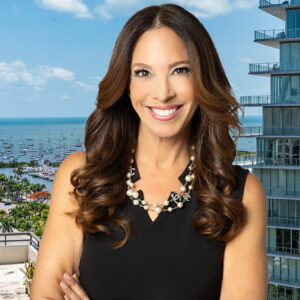 Michelle Suskauer, criminal defense attorney in West Palm Beach, FL. Blue sky and marina in background.